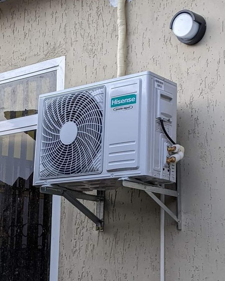 Hisense AC outdoor unit installed on a wall bracket